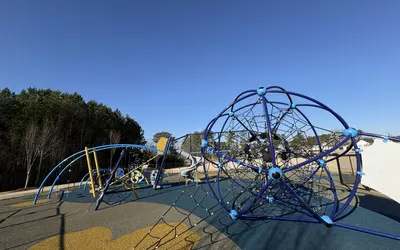 Inclusive playground with rubber surface at Garner Recreation Center Park